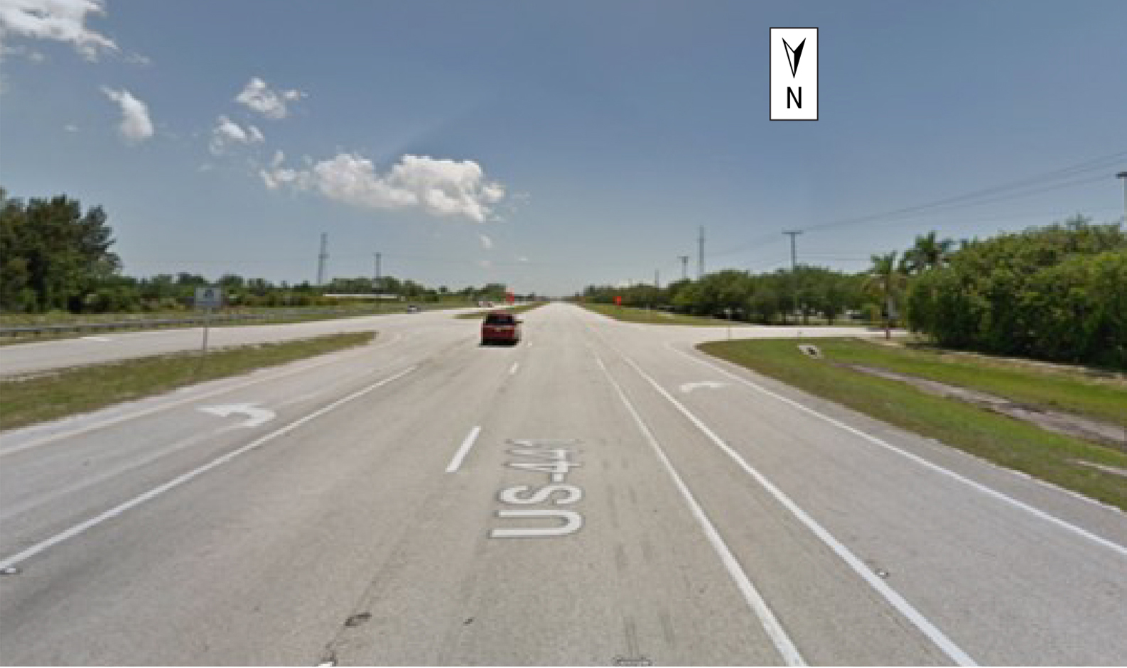 Southbound view of crash intersection. Private driveway into agricultural facility is visible on right side of image.
