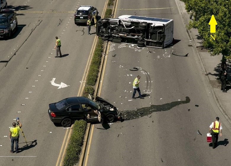 The final rest positions of the transit shuttle bus and passenger vehicle involved in the crash on International Blvd.