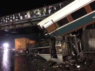 figure 2 derailed passenger railcars on interstate 5
