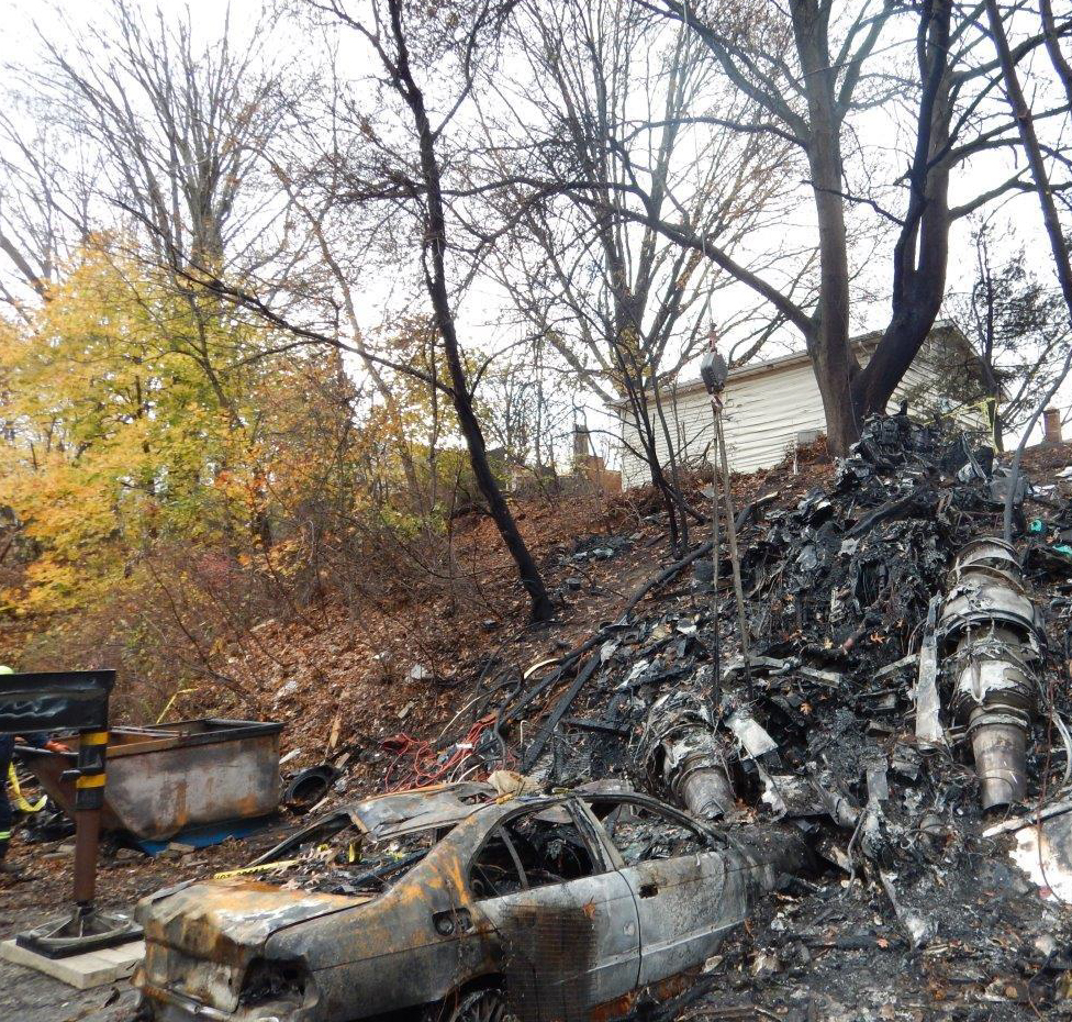 Photograph of the fuselage and engines at the accident site. 