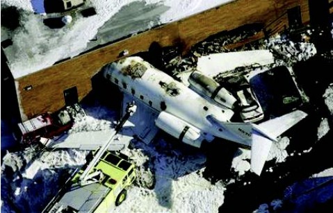 The accident airplane, the impacted building and several impacted vehicles, and the HRET/skin-penetrating nozzle-equipped firefi