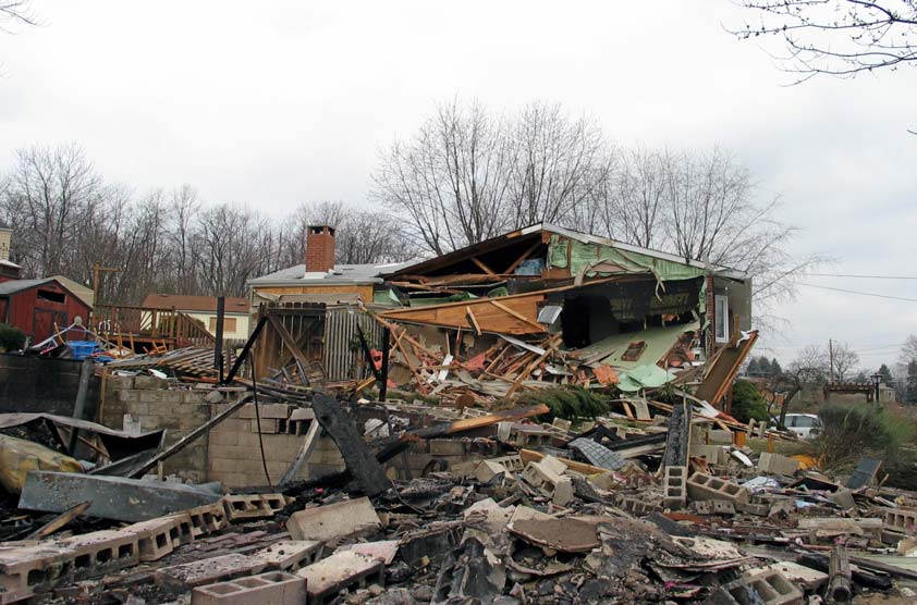 Damage to 171 Mardi Gras Drive.