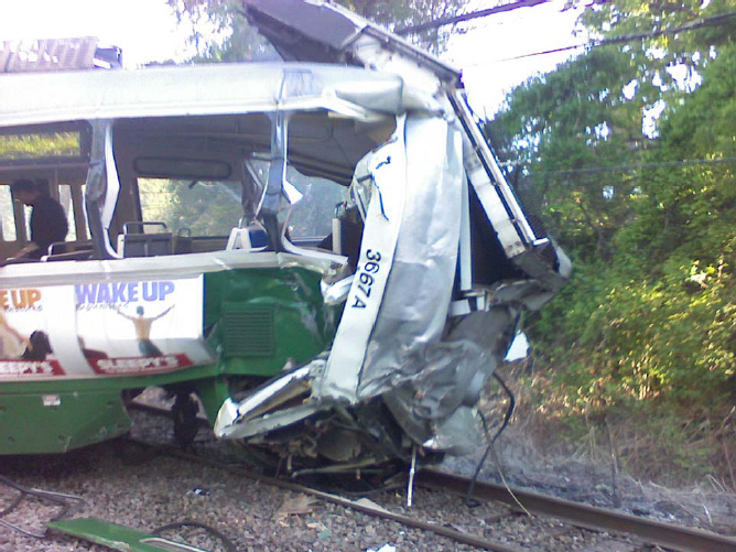 Photo of crushed lead car of striking train.