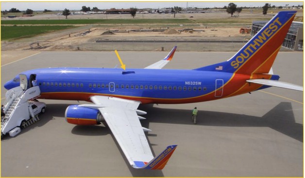 Photograph of N632SW with the hole in upper left fuselage. 