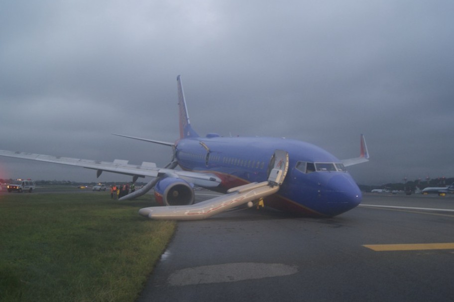 Photo of airplane post accident with nose on the ground