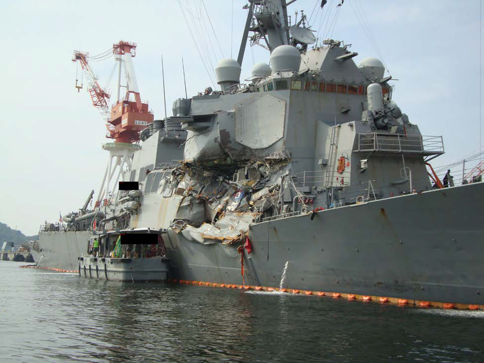 Photo of post collision damage to the Fitzgerald’s starboard side.