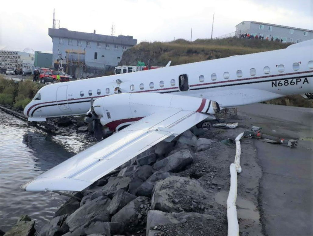 This photo shows the airplane in its final resting position on the shoreline of Dutch Harbor.