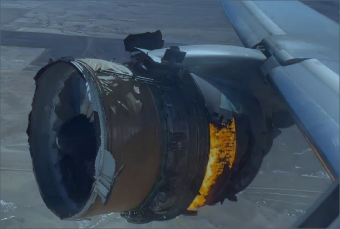 Still image from Passenger in-flight showing engine nacelle damage and under-cowl fire about 11 minutes after fan blade separati