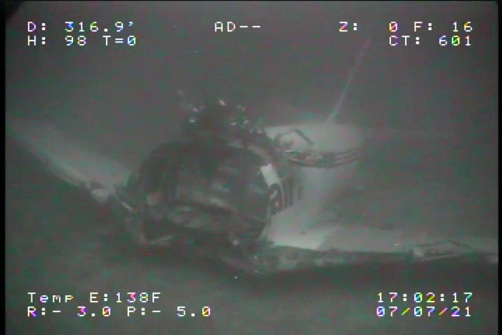 In this image taken July 7, 2021, the aft section of the fuselage of TransAir flight 810 is seen as it rests on the ocean floor.