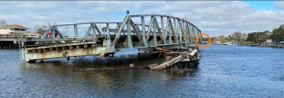 Photo of postaccident damage to the Barataria Bridge looking north. 