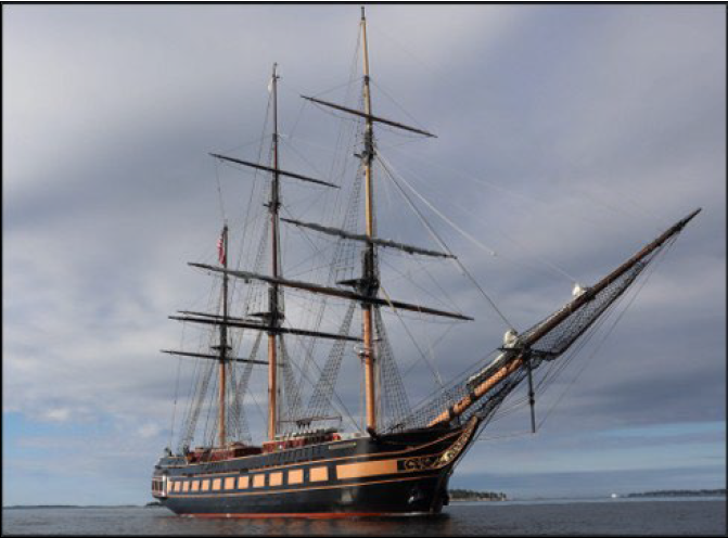 view of the school school vessel Oliver Hazard Perry forward of the bow and to starboard side. Vessel has 3 masts with sails tie