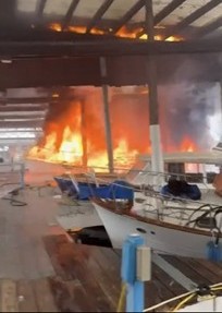 The Marina and vessel on fire.