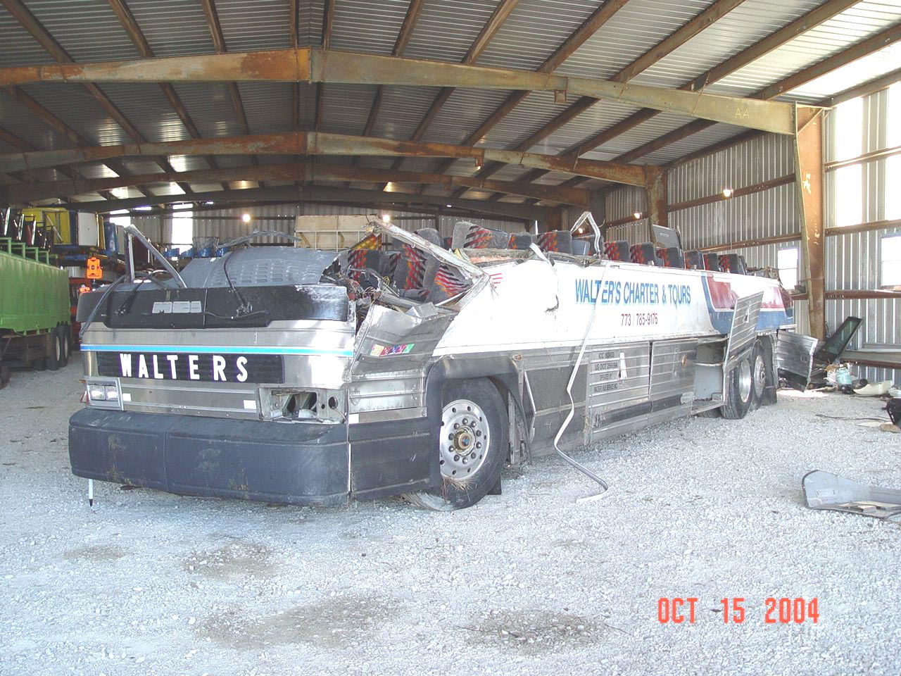 Motorcoach postaccident, with roof detached.