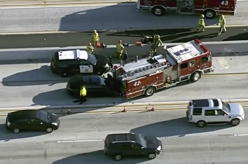 Overhead view of crash scene showing Tesla and fire truck at final rest on southbound I-405. 