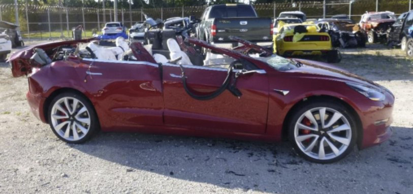 Photo of ther ight side of car in postcrash damaged condition.