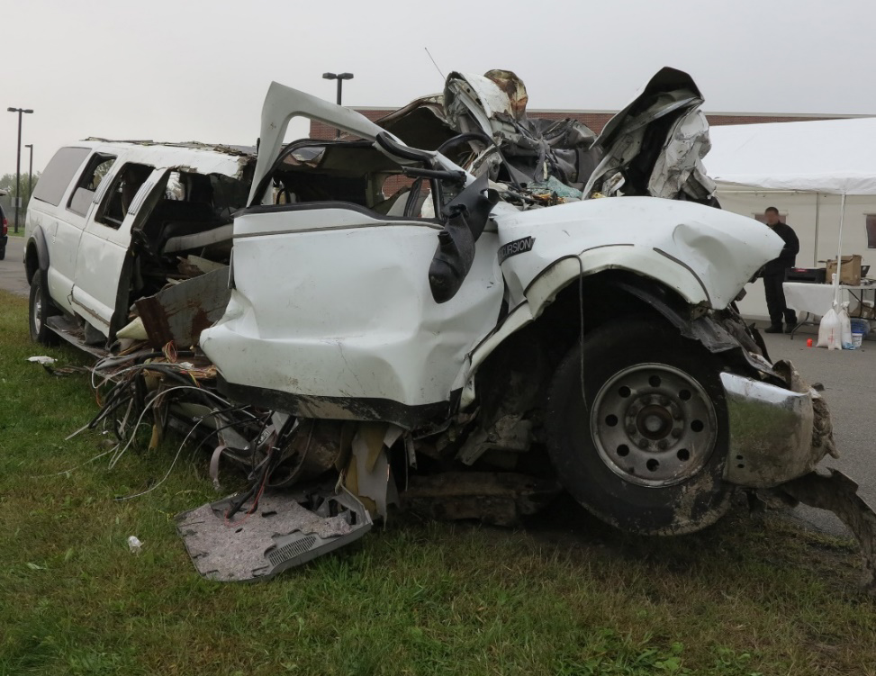 Photo of postcrash passenger side view of limousine (not in the crash final rest position).