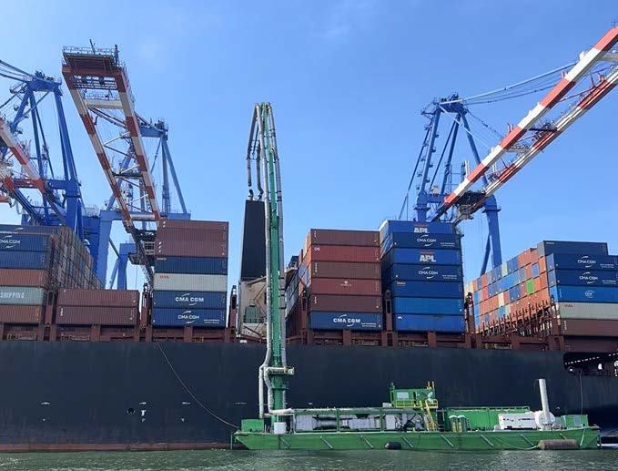 STAX 1 alongside Erving at Fenix Marine Service Container Terminal before the accident, with ship-to-shore cranes visible in the
