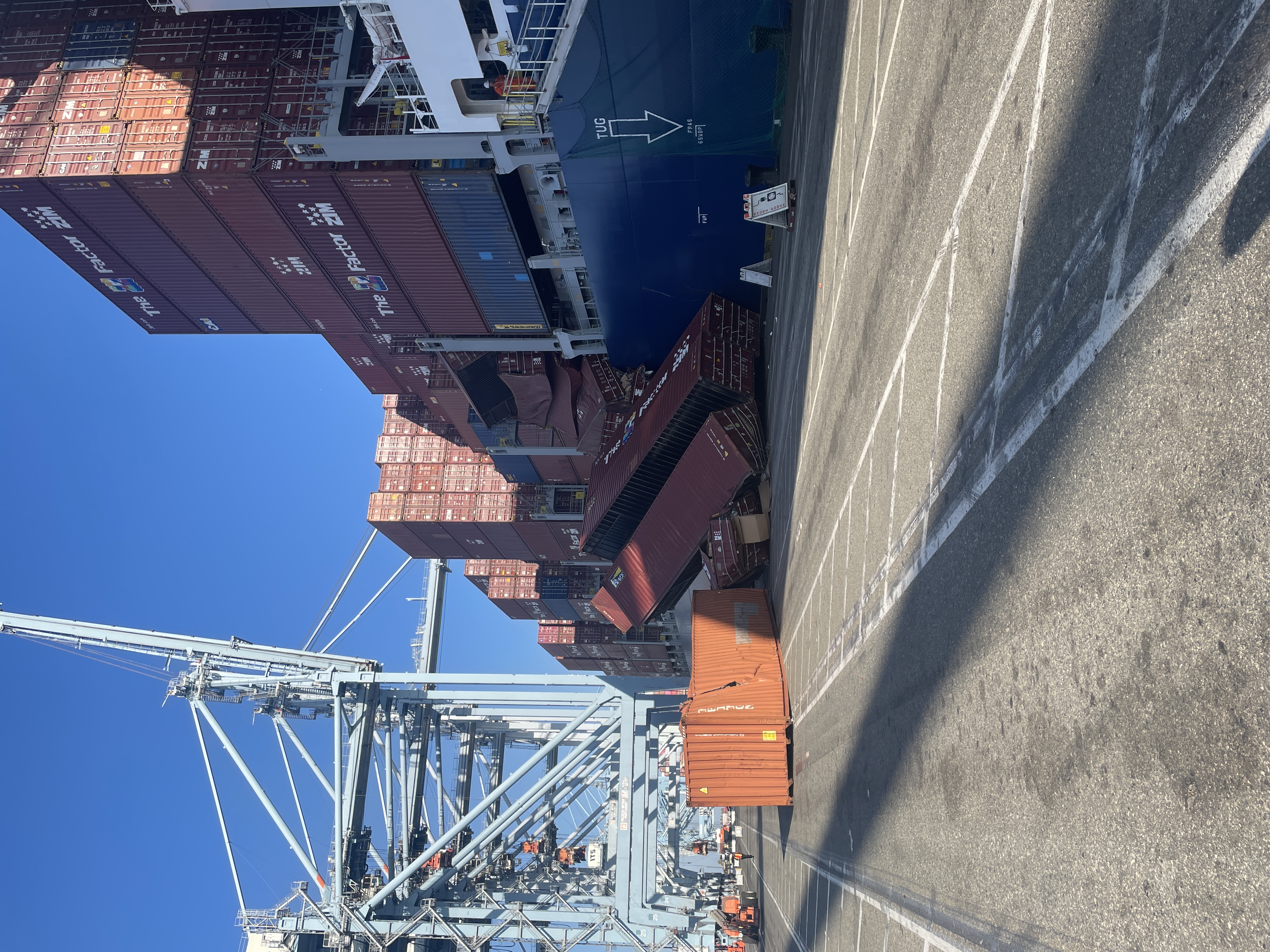 Collapsed containers on the starboard side of the containership Mississippi, with the emissions capture barge STAX2 alongside, o