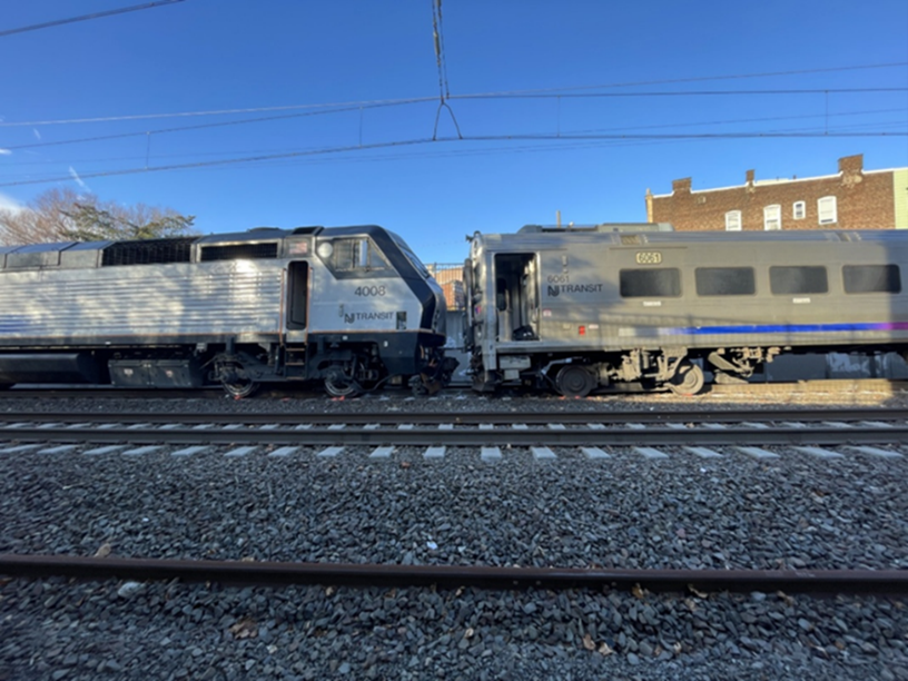 Point of collision with the locomotive of the struck train on the left; and the lead cab car of the striking train on the right.