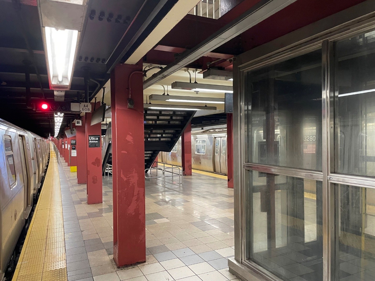 Utica Avenue Station platform with track A4 and an exemplar train to the left. 