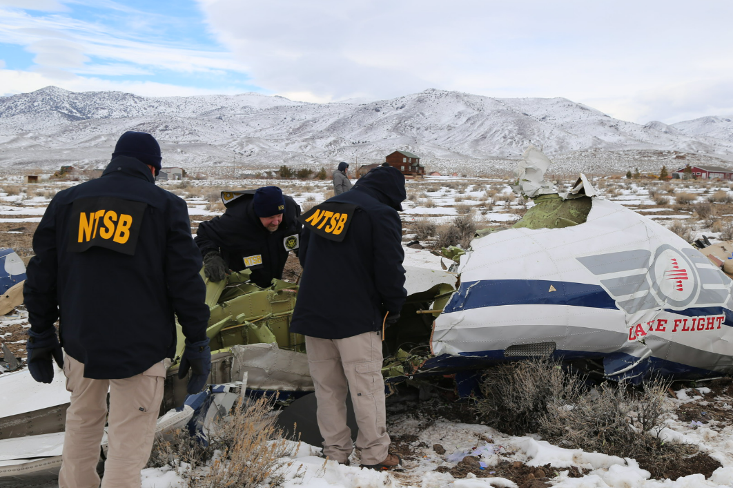 ​​​NTSB investigators documenting wreckage of a Pilatus PC-12 airplane at the crash site in Dayton, NV. 