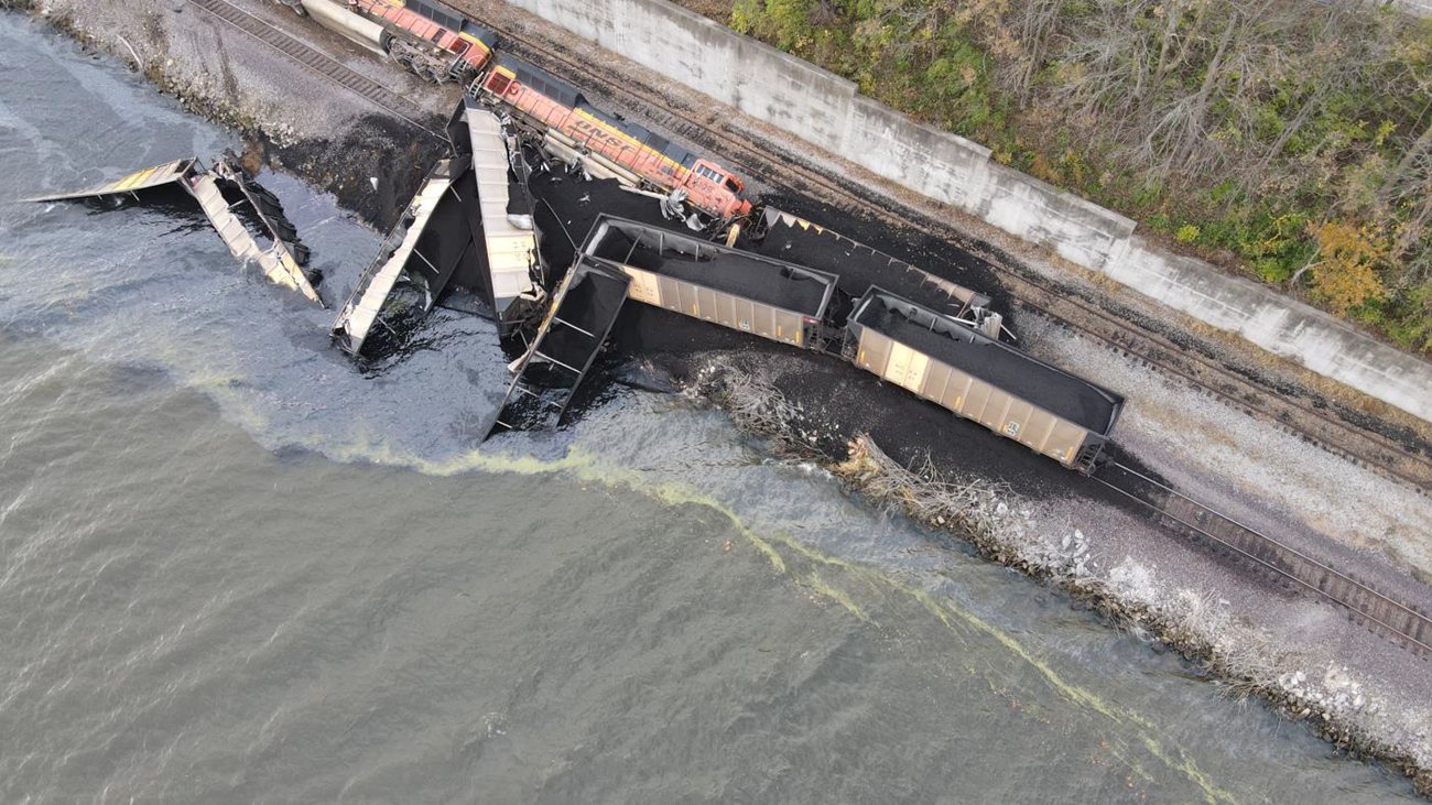 Aerial photo of the derailment of the two locomotives and eight hopper cars. 