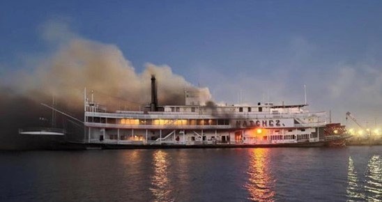 The Natchez is pictured on fire. 