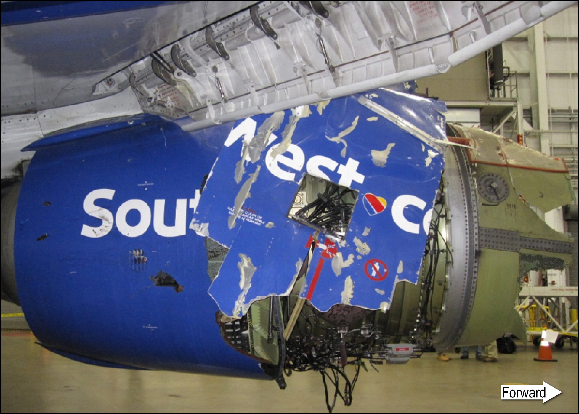 Photo of the damaged left fan cowl of Southwest Airlines flight 1380.